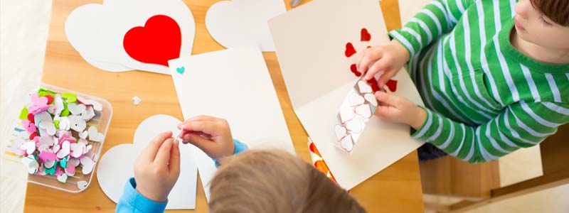 kids decorating valentines at a table valentines day party ideas for adults to plan 